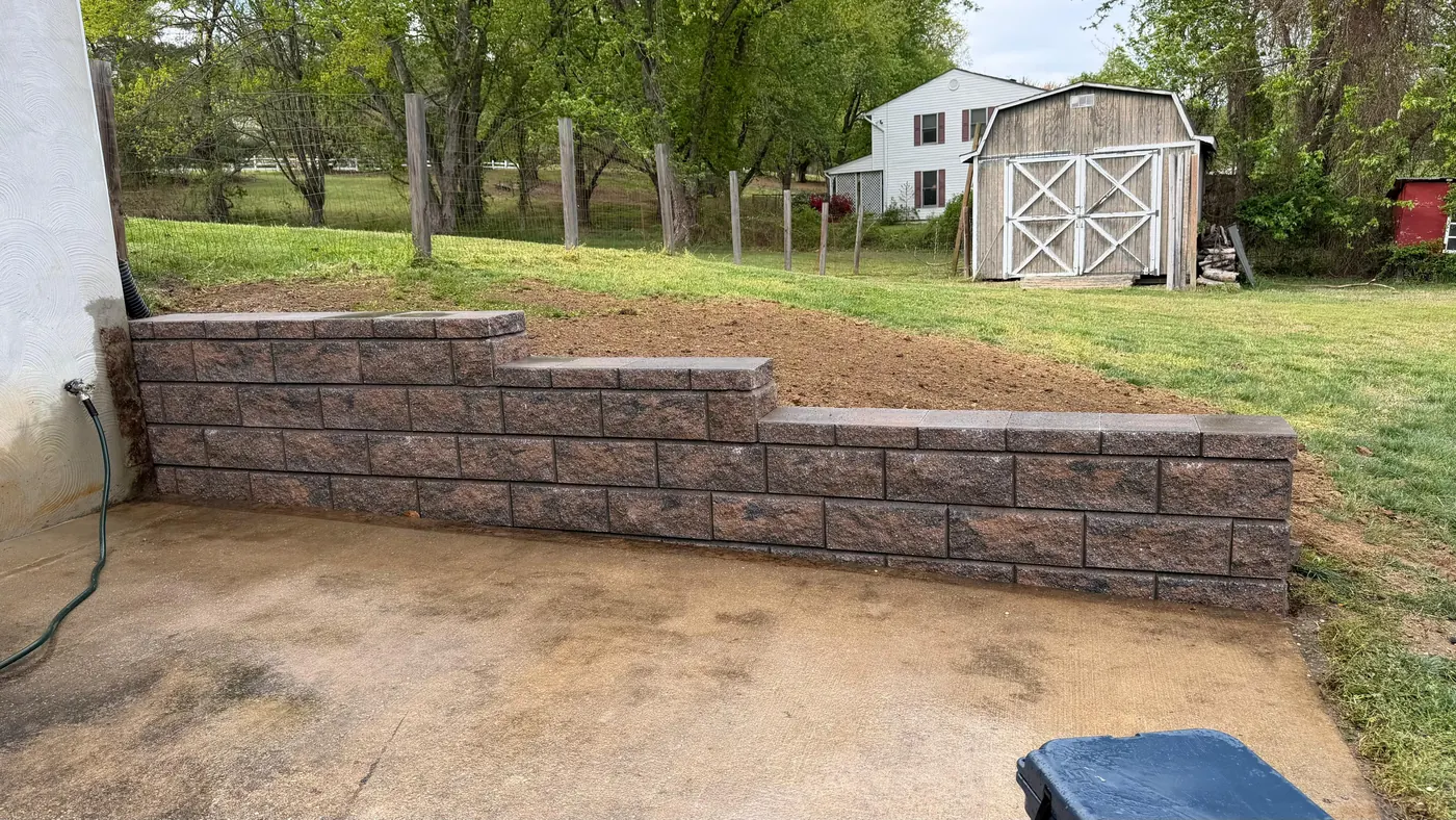 New block retaining wall built in the same spot